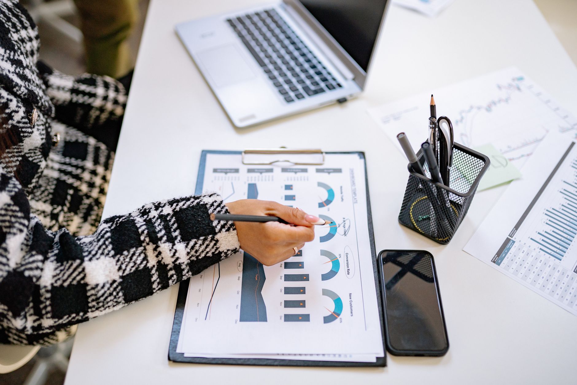 Business analyst reviewing clean analytical charts